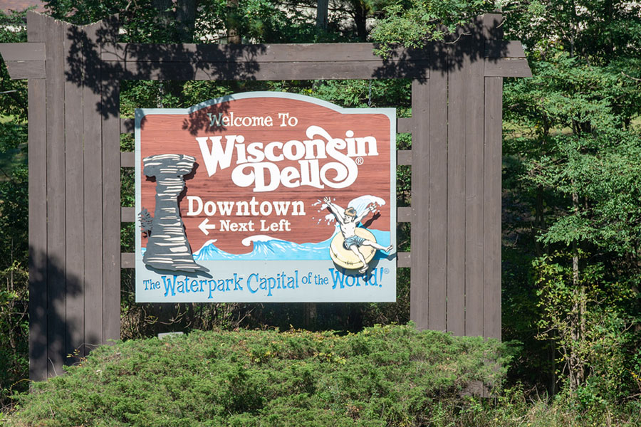 A sign stating Welcome to Wisconsin Dells, The Waterpark Capital of the World